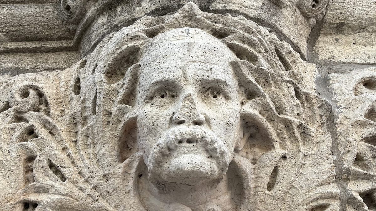 The five faces carved into the walls of Wichita’s former city hall